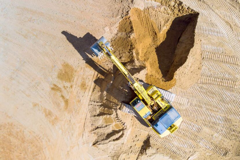 An excavator during earthworks at prepares trench for sewer pipes